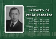 Foto de busto preta e branca do Desembargador Gilberto de Paula Pinheiro usando toga e gravata.